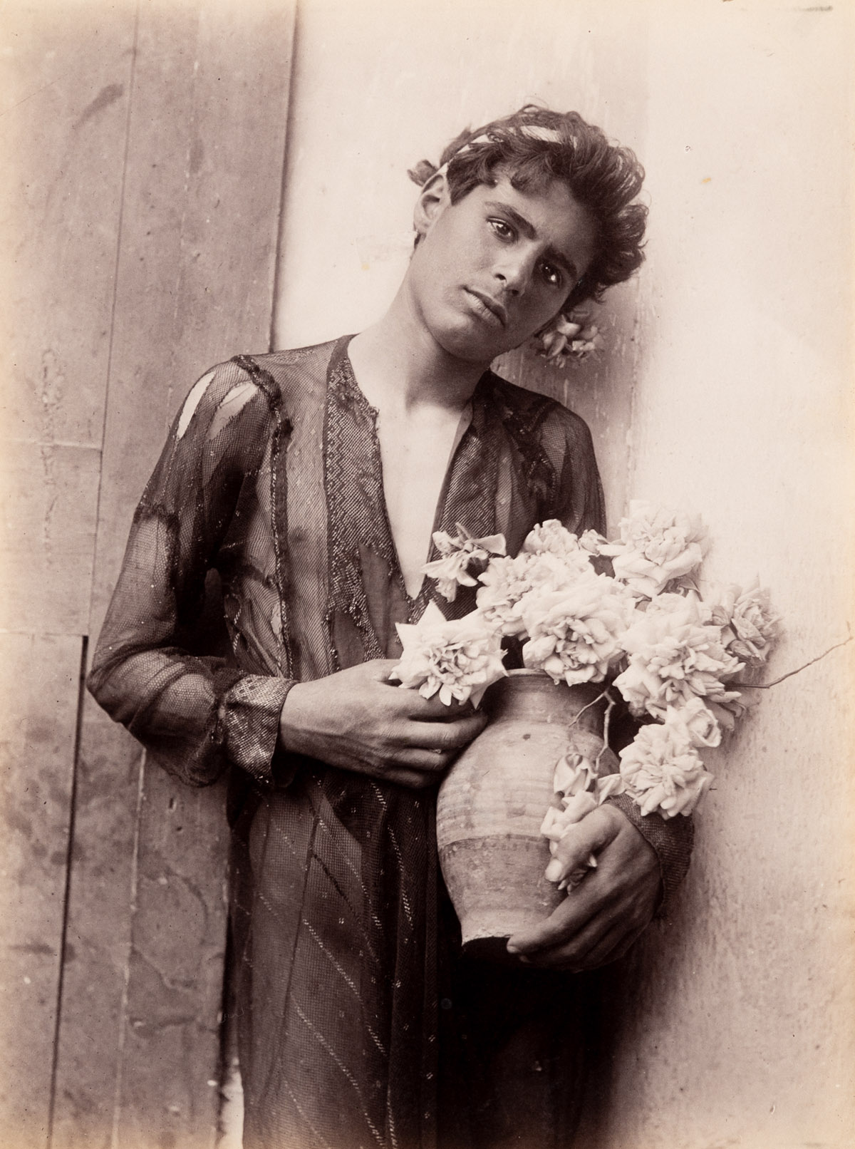 WILHELM VON GLOEDEN (1856-1931) Sicilian Boy with Flower Vase.